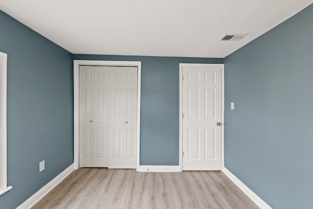 unfurnished bedroom featuring light hardwood / wood-style floors