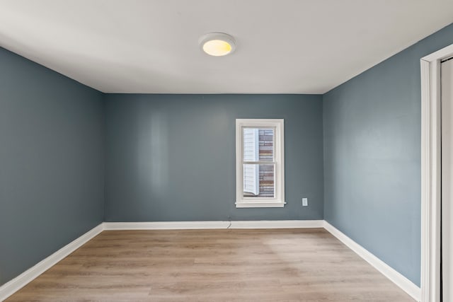 unfurnished room with light hardwood / wood-style flooring