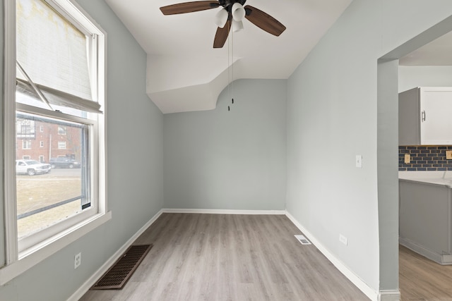 unfurnished room with ceiling fan and light hardwood / wood-style flooring