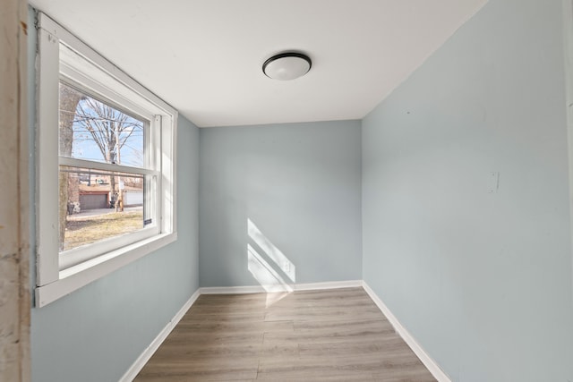 spare room with light hardwood / wood-style flooring