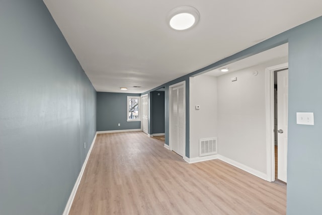 spare room featuring light wood-type flooring