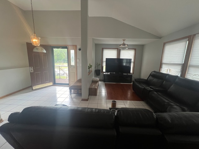 tiled living room with lofted ceiling