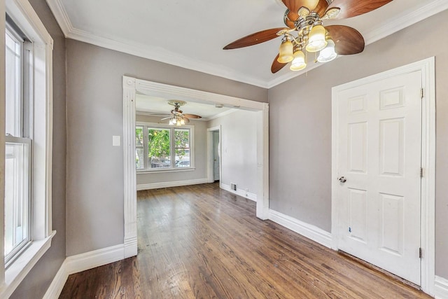 spare room with ceiling fan, hardwood / wood-style floors, and ornamental molding