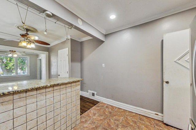 kitchen featuring crown molding and wood-type flooring