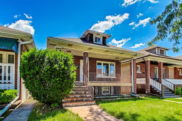 view of front of home featuring a front lawn and a porch