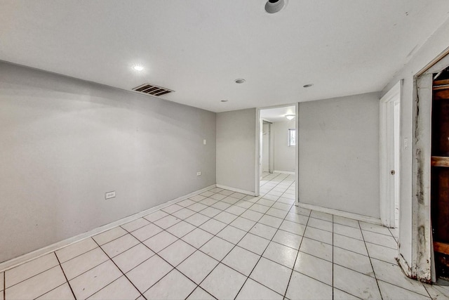 empty room with light tile patterned flooring