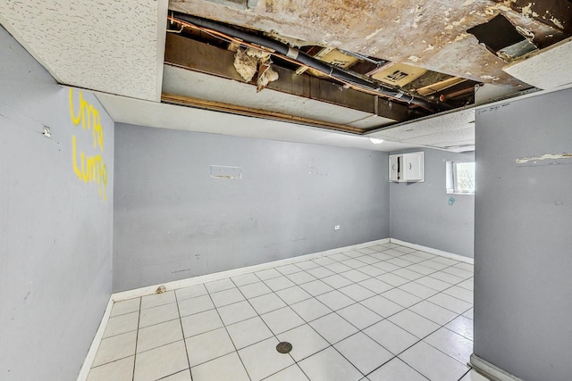 basement featuring light tile patterned floors