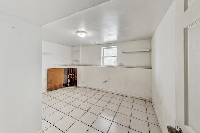 unfurnished room with light tile patterned floors