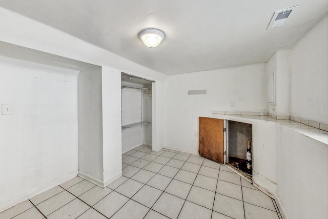 interior space with light tile patterned floors