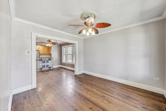 unfurnished living room with dark hardwood / wood-style flooring and ornamental molding