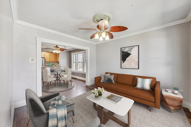 living room featuring crown molding and hardwood / wood-style flooring