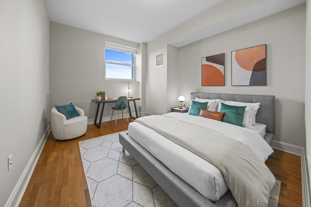 bedroom with wood-type flooring