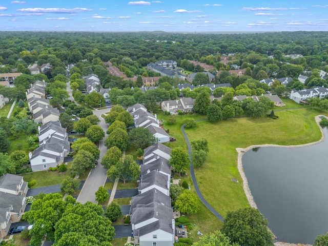 drone / aerial view with a water view and a residential view