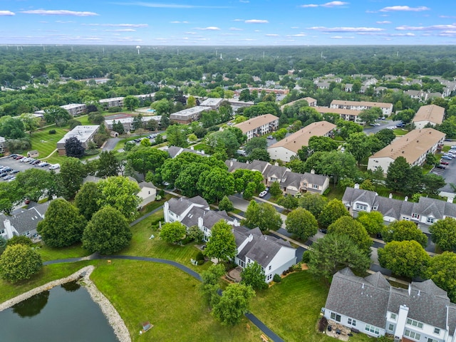 drone / aerial view featuring a water view and a residential view