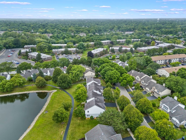 birds eye view of property with a water view and a residential view