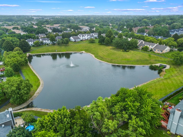 drone / aerial view with a residential view and a water view