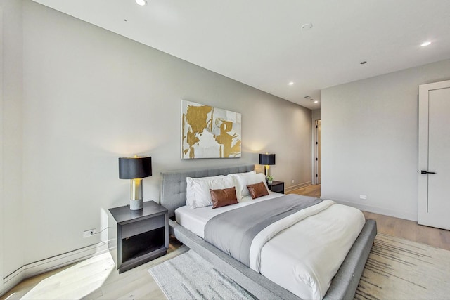 bedroom featuring light hardwood / wood-style floors