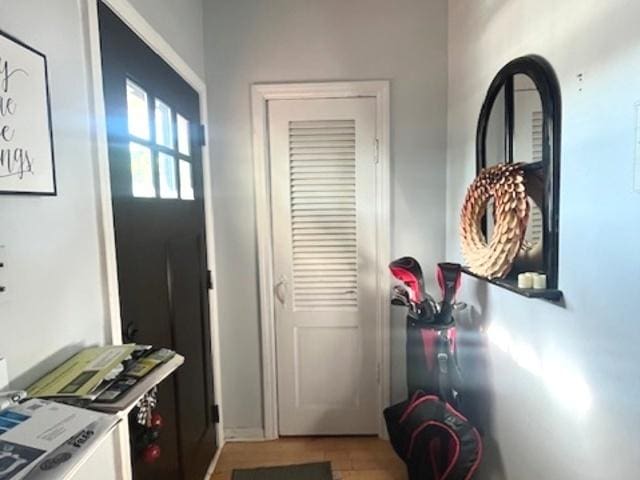 doorway featuring tile patterned flooring