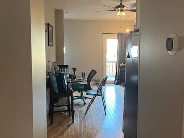 interior space featuring light wood-type flooring and ceiling fan