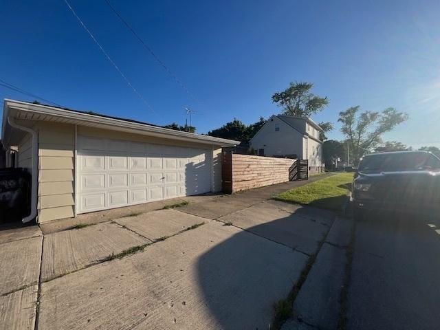 view of property exterior featuring a garage