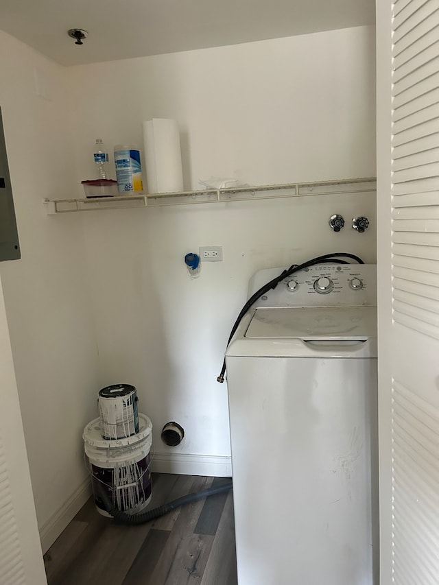 clothes washing area with dark hardwood / wood-style flooring and washer / clothes dryer