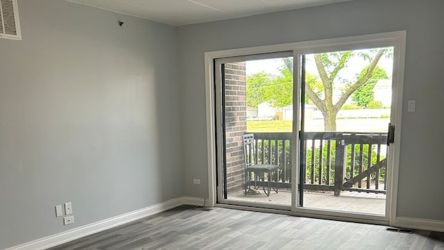 doorway to outside featuring wood-type flooring