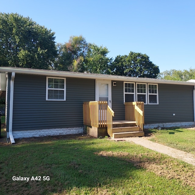 view of front of home with a front yard