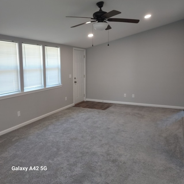 unfurnished room featuring ceiling fan, baseboards, carpet flooring, and recessed lighting