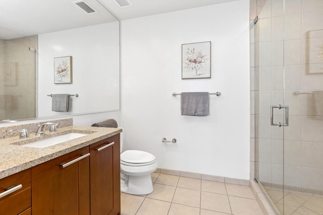 bathroom with tile patterned floors, walk in shower, vanity, and toilet