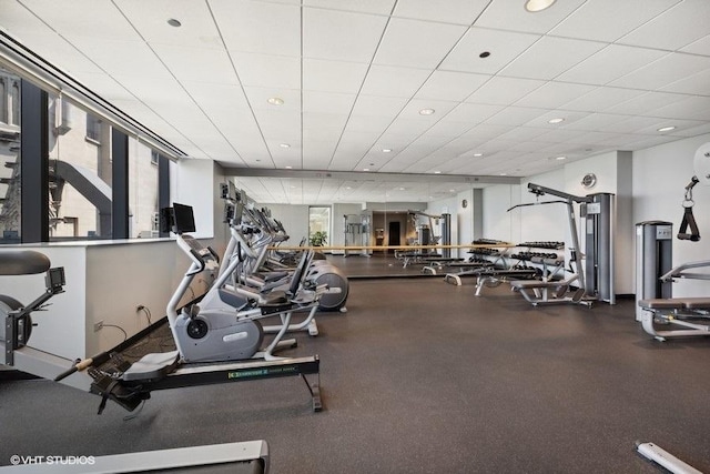 workout area featuring a paneled ceiling