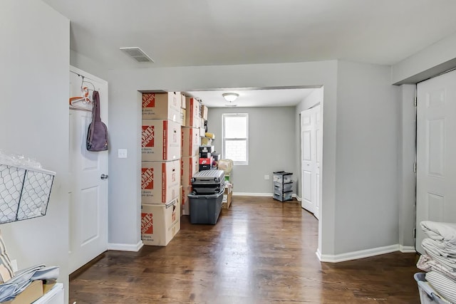 hallway featuring dark hardwood / wood-style flooring