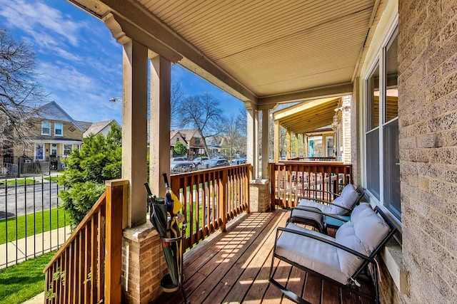 wooden terrace featuring covered porch