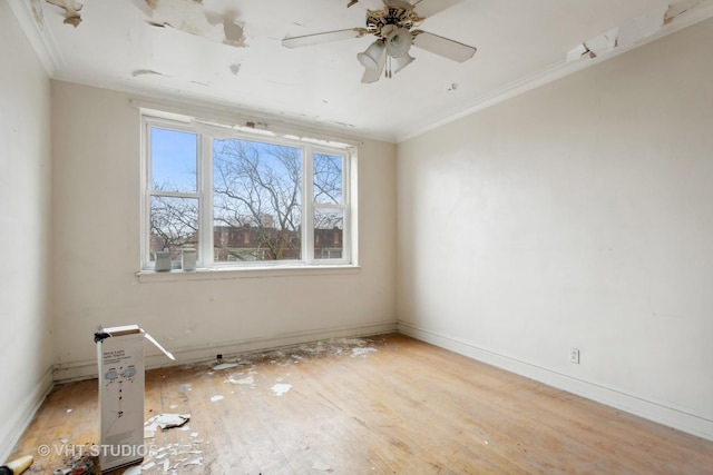 empty room featuring light hardwood / wood-style floors, ceiling fan, and ornamental molding