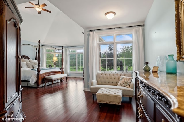 bedroom featuring dark wood-type flooring, ceiling fan, and high vaulted ceiling