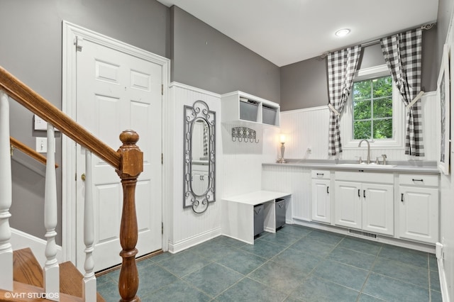 bathroom with tile patterned flooring and vanity