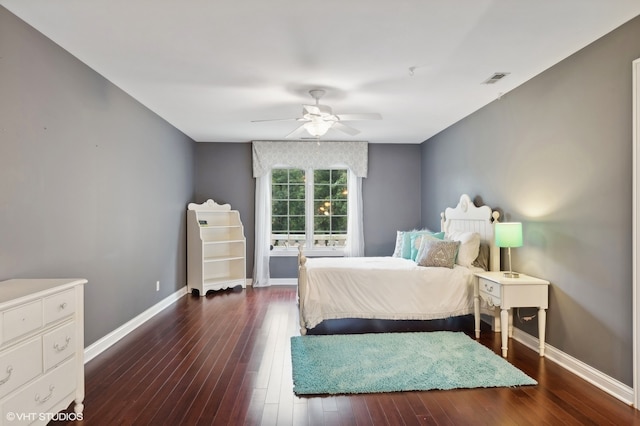 bedroom with dark wood-type flooring and ceiling fan