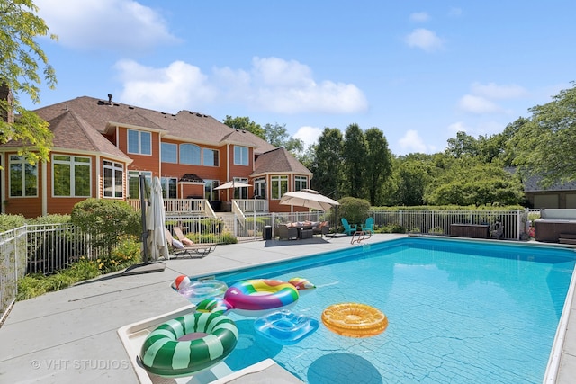 view of swimming pool with a patio