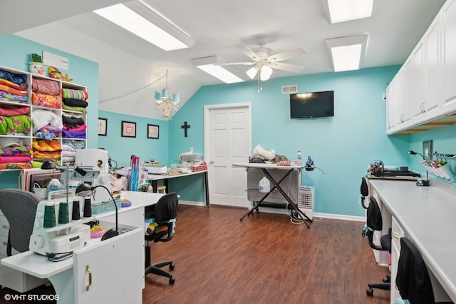 office featuring lofted ceiling, ceiling fan with notable chandelier, and dark hardwood / wood-style floors