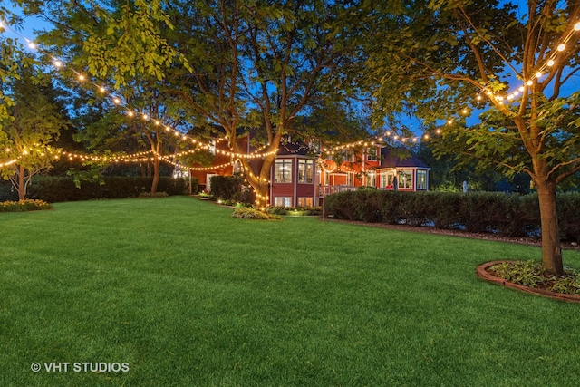 view of yard at night