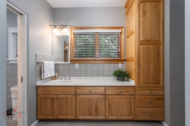 bathroom featuring backsplash and vanity