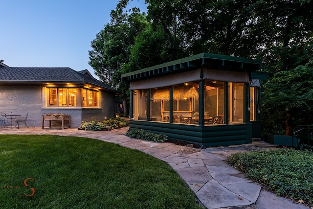 rear view of house with a lawn