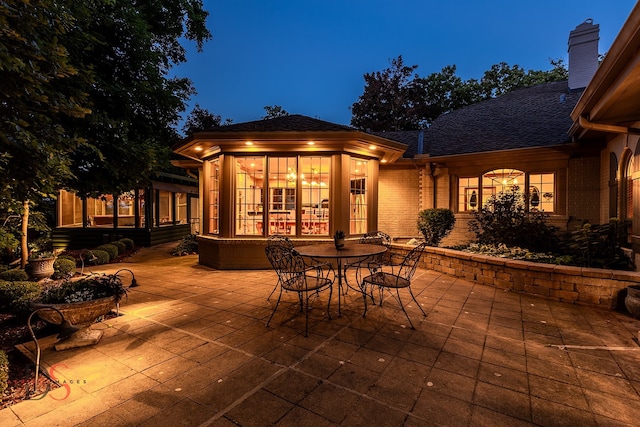 view of patio terrace at twilight