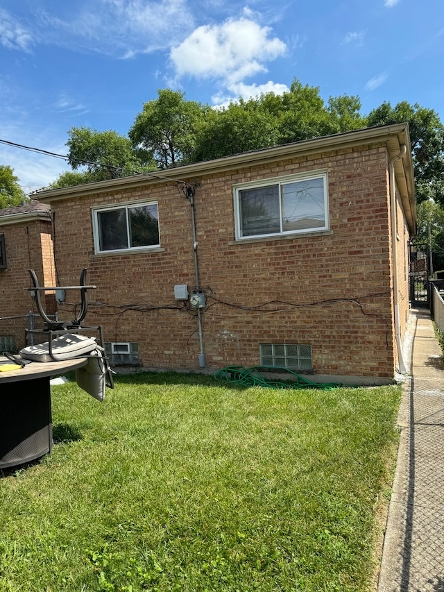 view of property exterior featuring a lawn