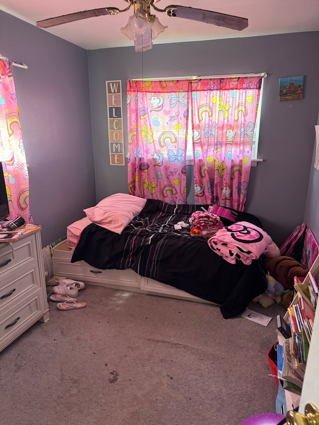 carpeted bedroom with ceiling fan