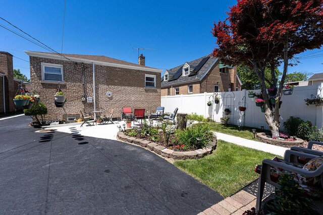 rear view of property featuring a patio