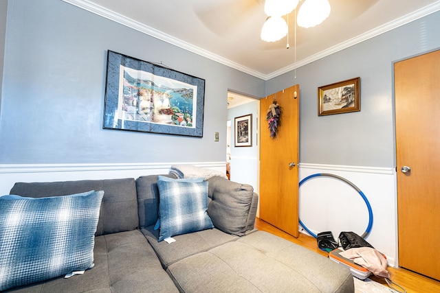 interior space featuring crown molding, hardwood / wood-style flooring, and ceiling fan