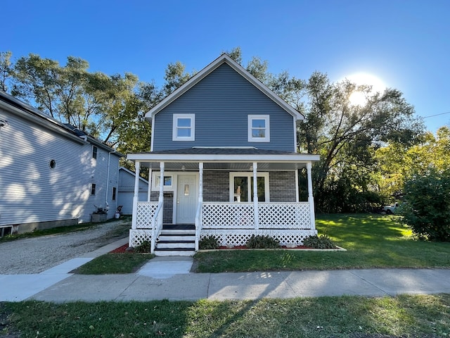 view of front of home featuring a porch and a front lawn