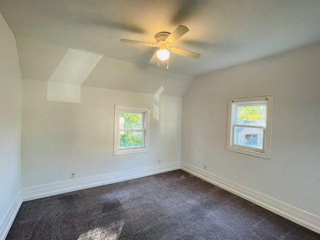 bonus room with lofted ceiling, carpet floors, and ceiling fan