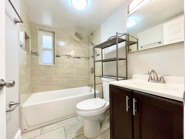 full bathroom featuring vanity, toilet, and tiled shower / bath