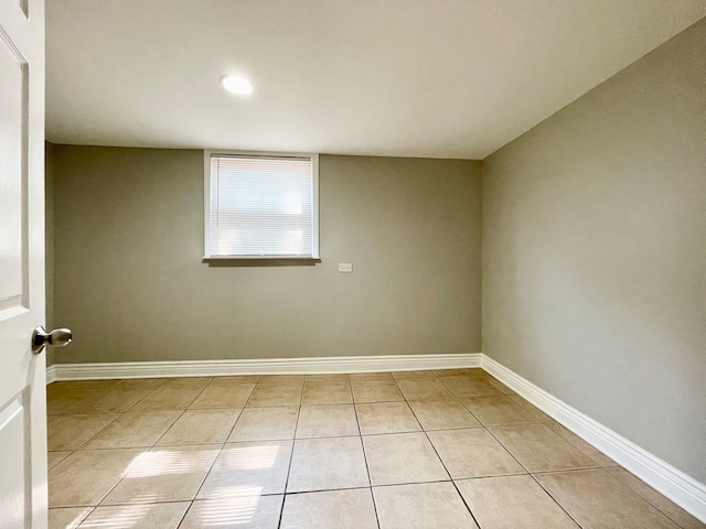 unfurnished room with light tile patterned floors